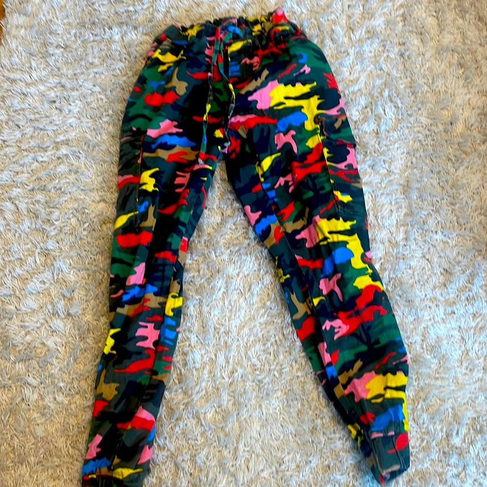 These are loose, denim, rainbow camo joggers. The brand is Almost Famous!